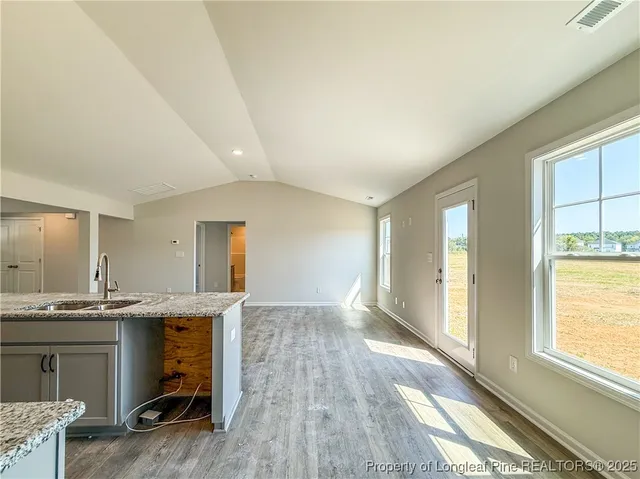 a view of kitchen and windows