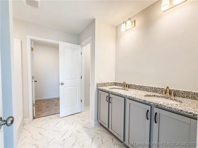 a view of a kitchen with a sink and dishwasher
