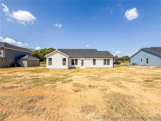 a view of house and yard with swimming pool