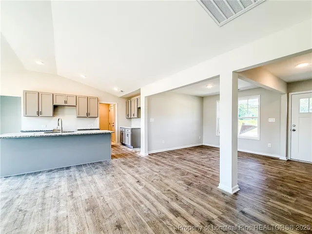 a view of kitchen with wooden floor