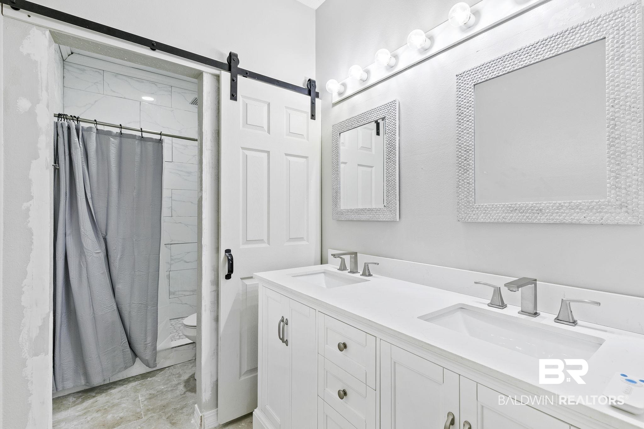 474 Ridgewood Drive Daphne, AL 36526 - Photo 32 of 57 Bathroom featuring vanity, toilet, and walk in shower