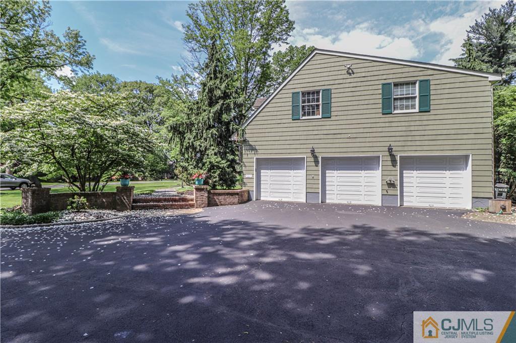 4 Southfield Road Edison, NJ 08820 - Photo 2 of 46 a view of a house with a yard and garage