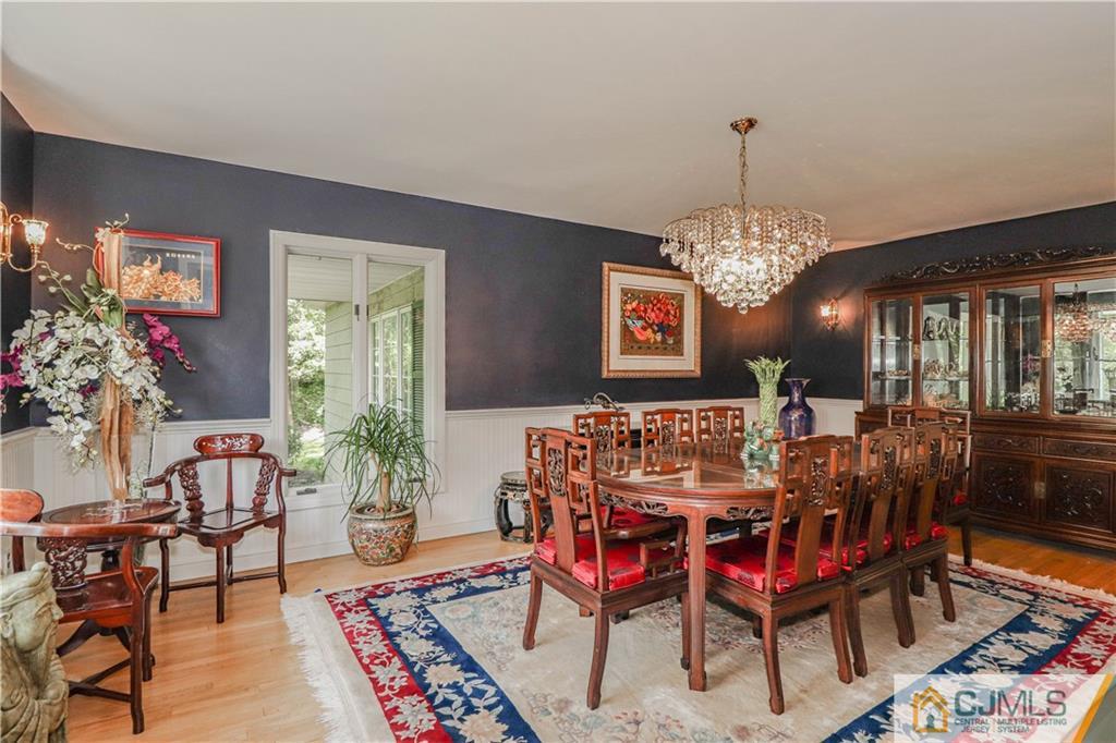 4 Southfield Road Edison, NJ 08820 - Photo 11 of 46 a view of a dining room with furniture and chandelier