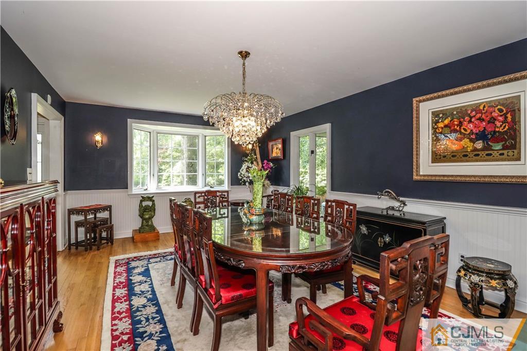 4 Southfield Road Edison, NJ 08820 - Photo 12 of 46 a view of a dining room with furniture window and wooden floor