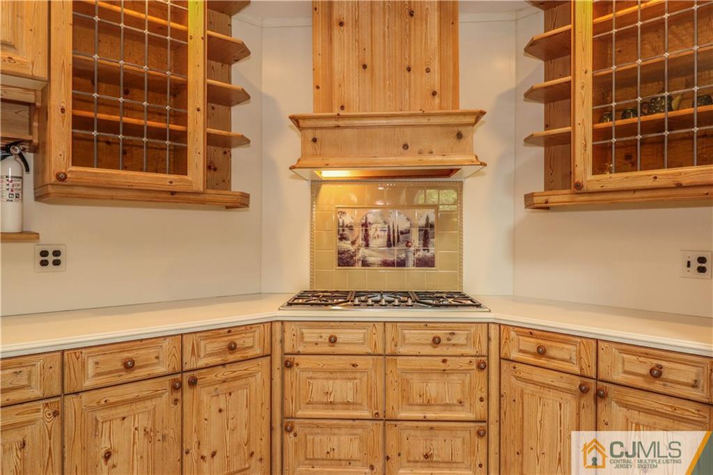 4 Southfield Road Edison, NJ 08820 - Photo 20 of 46 a view of a kitchen with wooden cabinets