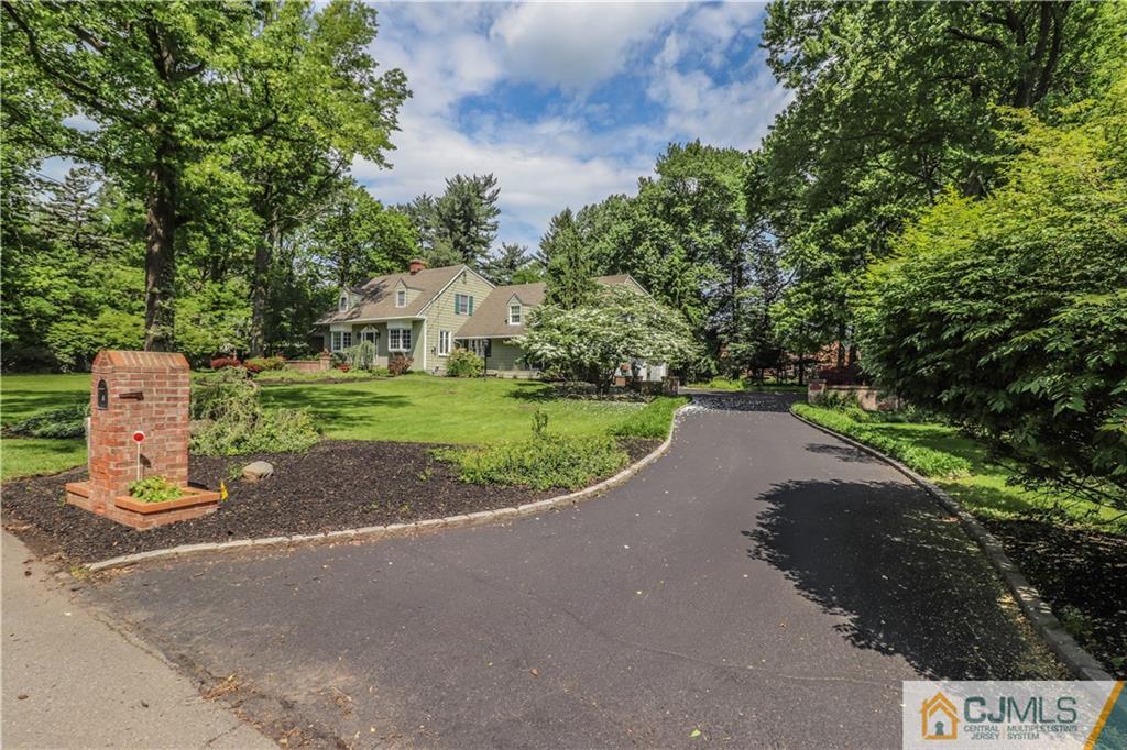 4 Southfield Road Edison, NJ 08820 - Photo 3 of 46 a view of a park with a house in the background