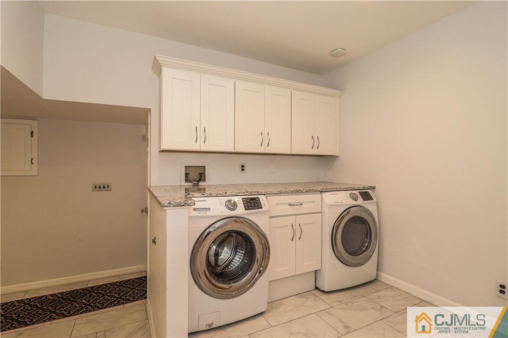 4 Southfield Road Edison, NJ 08820 - Photo 23 of 46 a utility room with dryer and washer