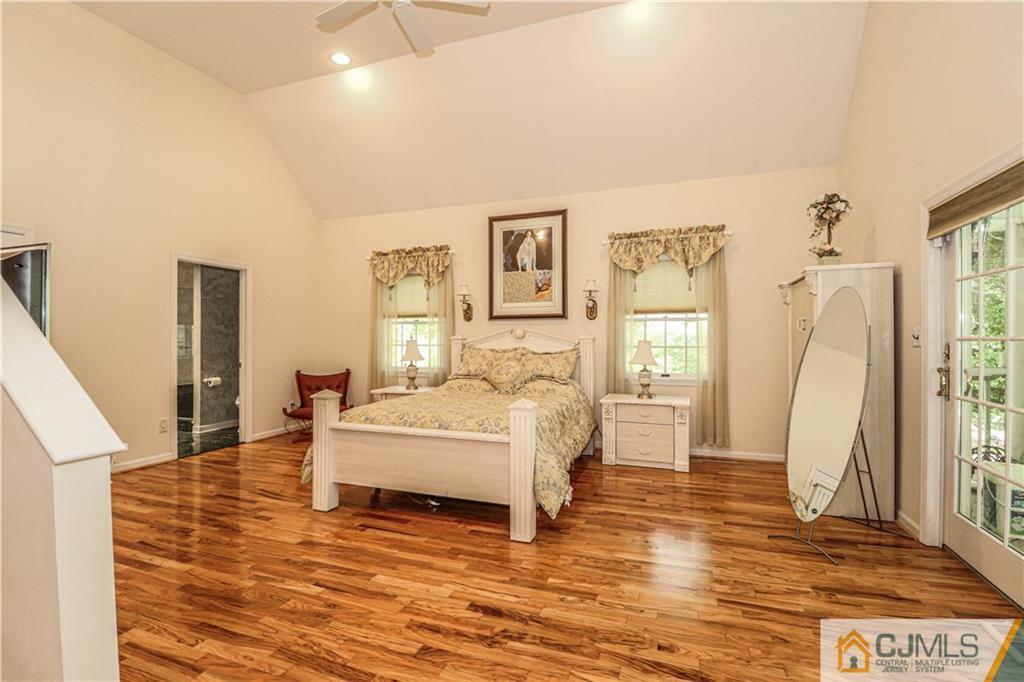 4 Southfield Road Edison, NJ 08820 - Photo 26 of 46 a spacious bedroom with a bed and a large window