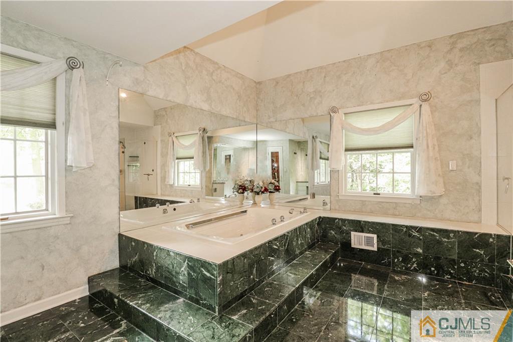 4 Southfield Road Edison, NJ 08820 - Photo 28 of 46 a bathroom with a sink and a bathtub