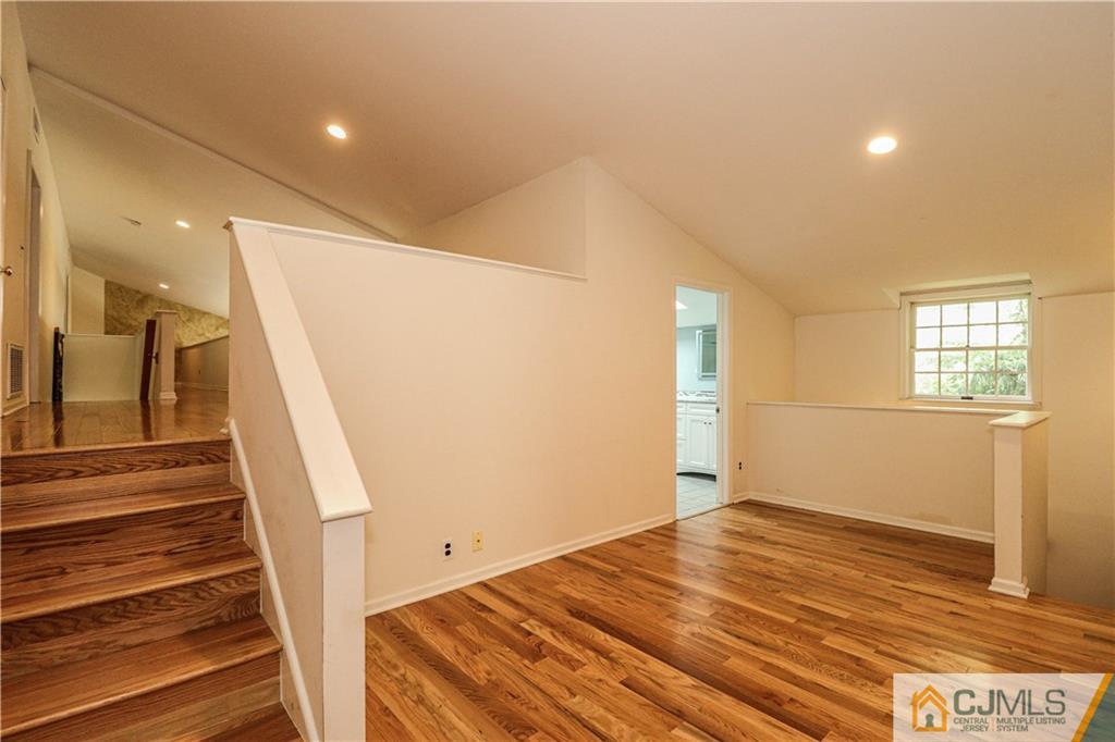 4 Southfield Road Edison, NJ 08820 - Photo 30 of 46 a view of a room with wooden floor and stairs