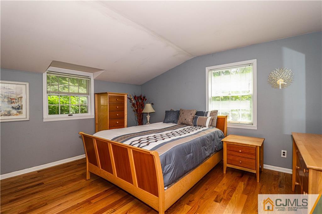 4 Southfield Road Edison, NJ 08820 - Photo 32 of 46 a bedroom with a bed and a window