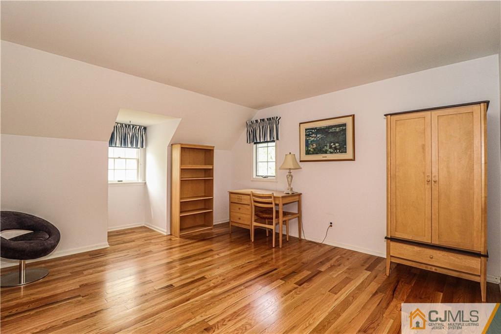 4 Southfield Road Edison, NJ 08820 - Photo 34 of 46 a view of a livingroom with furniture and wooden floor