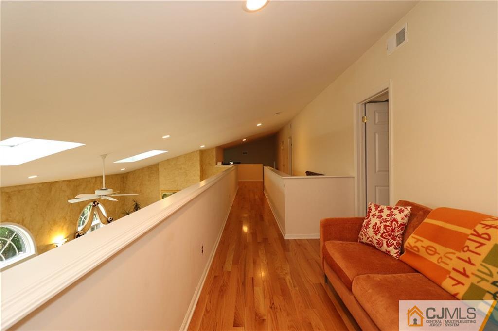 4 Southfield Road Edison, NJ 08820 - Photo 38 of 46 a living room with a couch and wooden floor