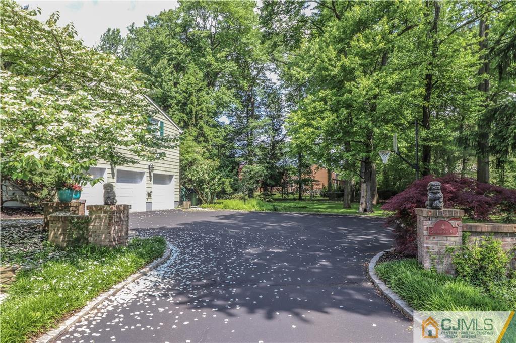 4 Southfield Road Edison, NJ 08820 - Photo 5 of 46 a view of a backyard with a garden and trees