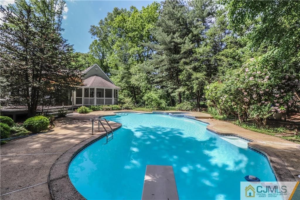 4 Southfield Road Edison, NJ 08820 - Photo 41 of 46 a view of a swimming pool with a patio