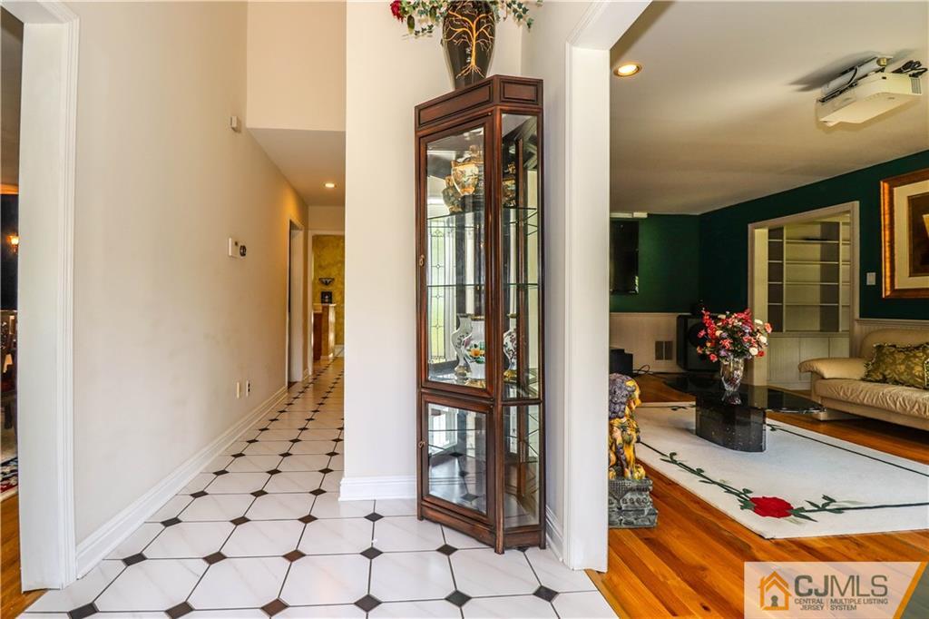 4 Southfield Road Edison, NJ 08820 - Photo 7 of 46 a hallway with dining table and chairs