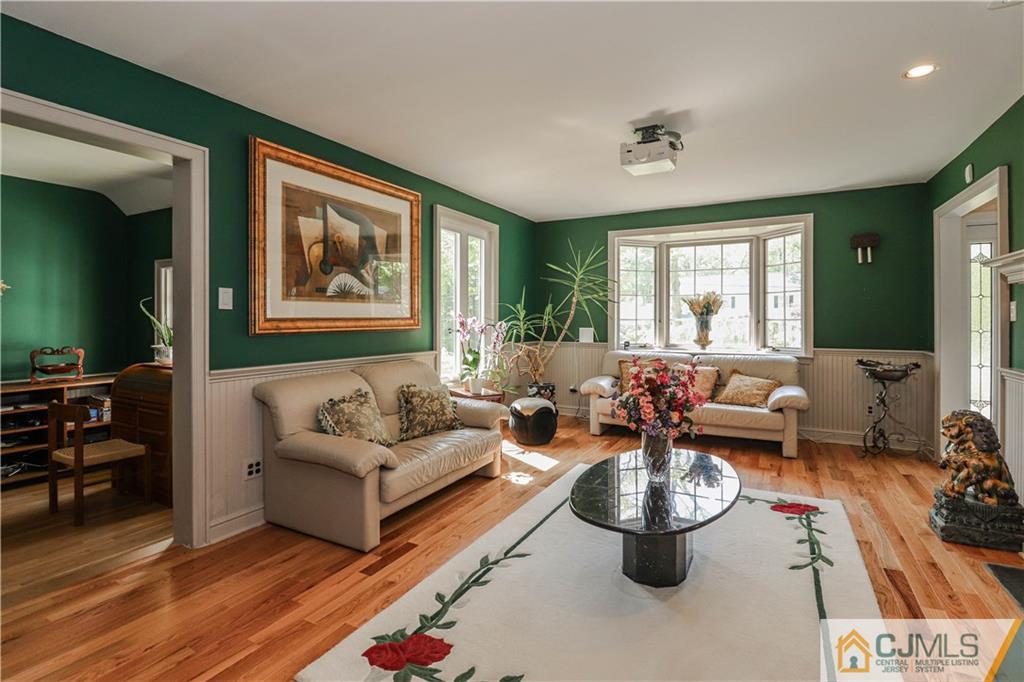 4 Southfield Road Edison, NJ 08820 - Photo 9 of 46 a living room with furniture and a large window