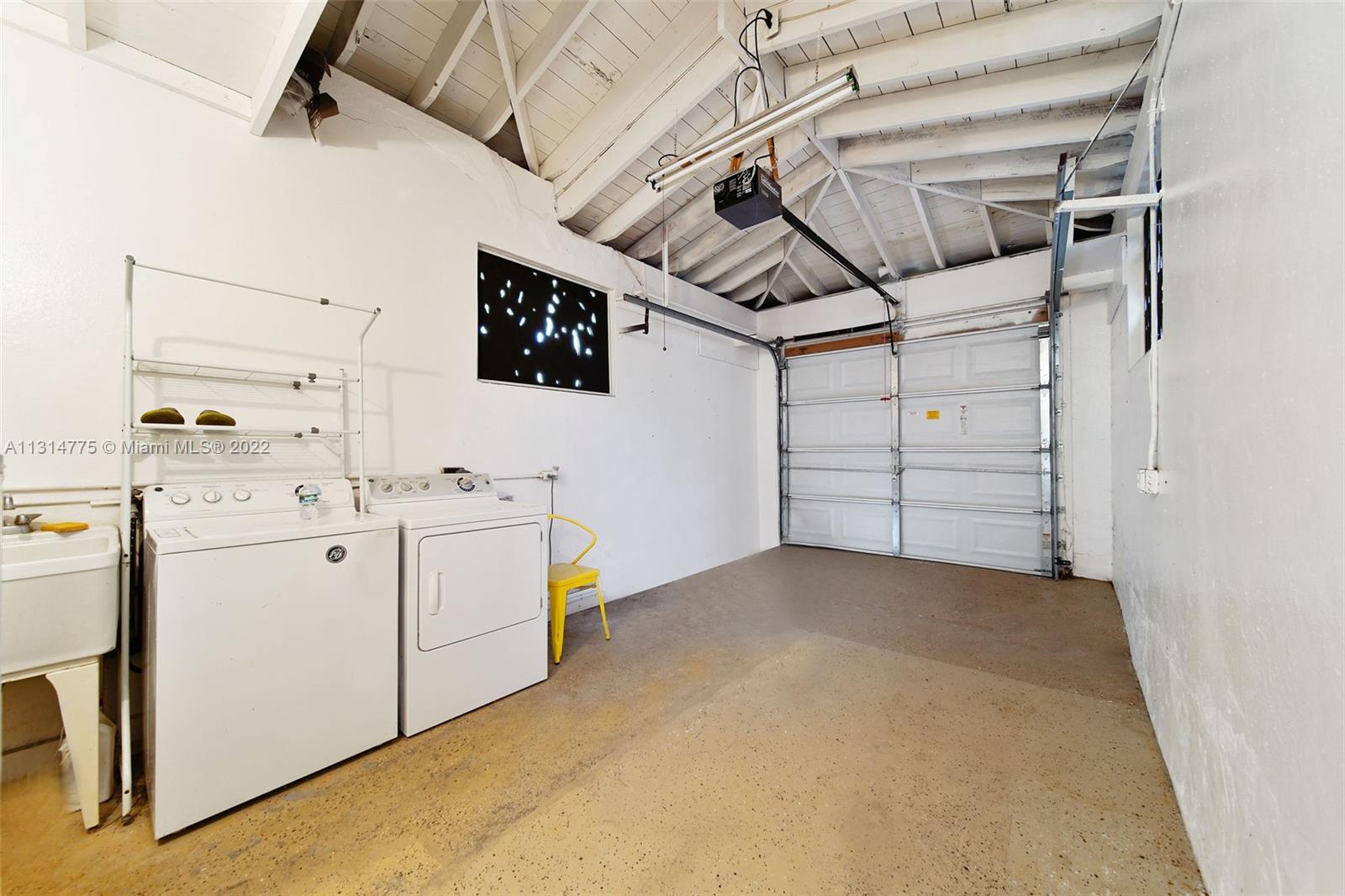 9116 Abbott Avenue Surfside, FL 33154 - Photo 18 of 23 a utility room with cabinets