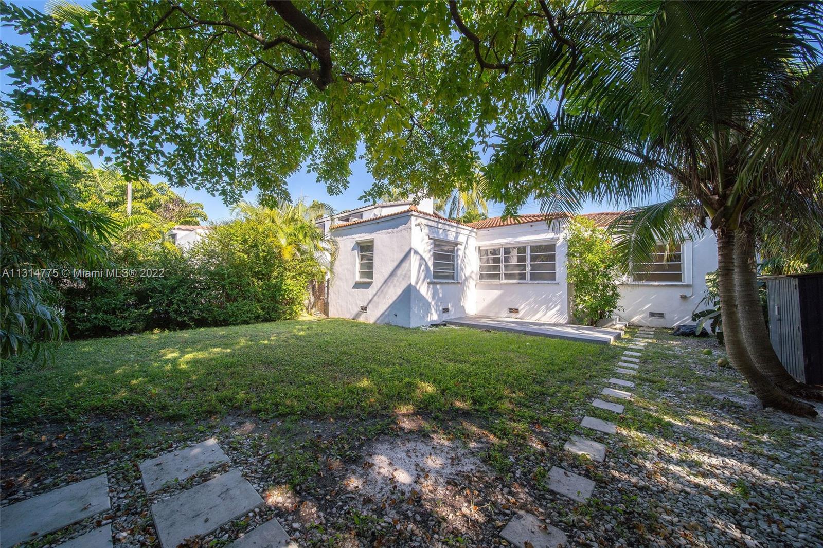 9116 Abbott Avenue Surfside, FL 33154 - Photo 21 of 23 a view of a house with a yard