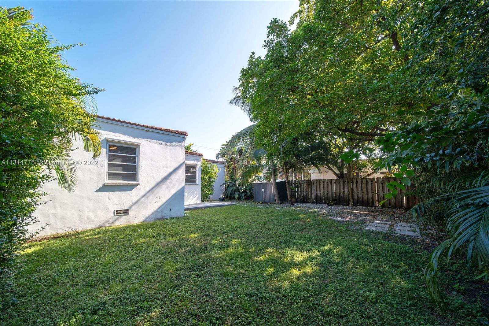 9116 Abbott Avenue Surfside, FL 33154 - Photo 22 of 23 a view of a backyard with a small cabin