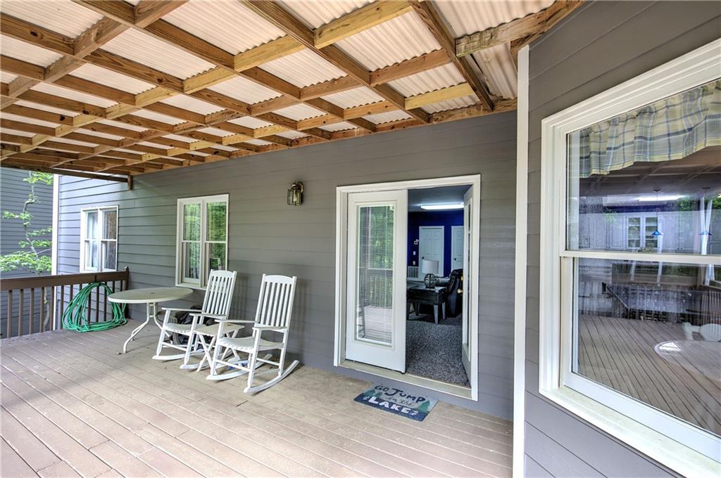 181 Fox Den Circle Jasper, GA 30143 - Photo 69 of 111 a view of a patio with a table and chairs and wooden floor