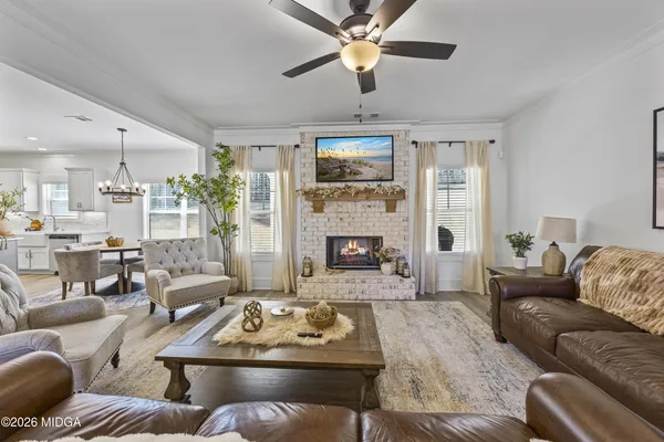 a living room with furniture and a fireplace
