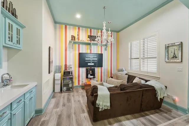 a living room with furniture and large windows