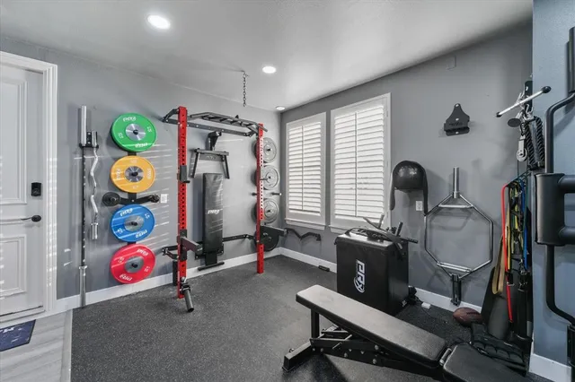 a room with gym equipment and a window