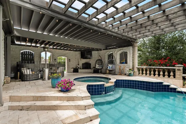 a view of a porch with furniture and garden