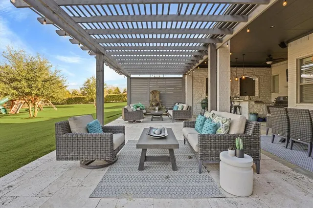 a view of a porch with furniture and yard