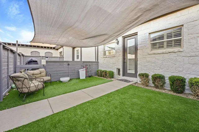 a view of a house with a backyard and a garden