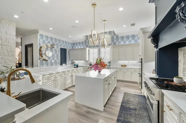 a kitchen with counter top space cabinets and stainless steel appliances