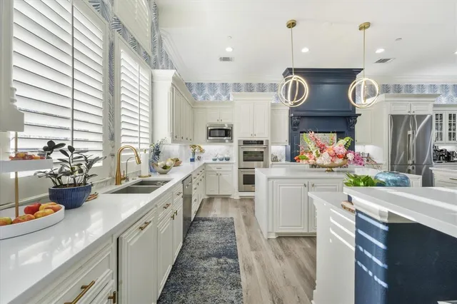 a large kitchen with lots of counter space and window