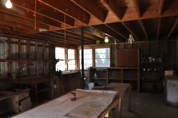 a kitchen with a table and chairs in it