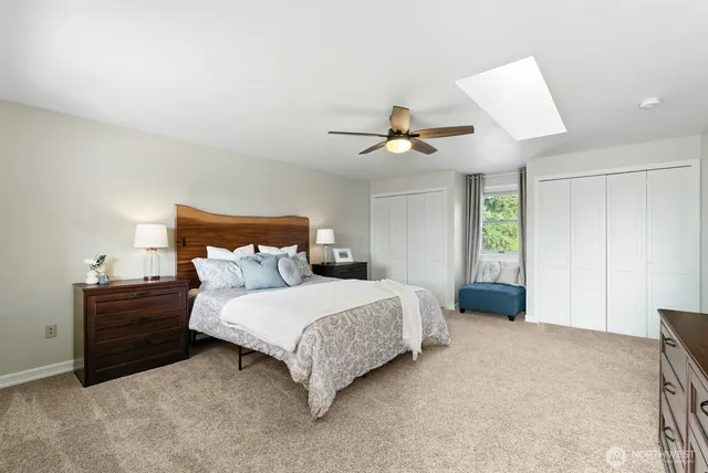 a bedroom with a bed and window