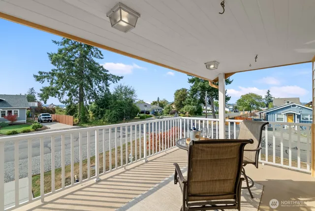 a view of a two chairs on the roof deck