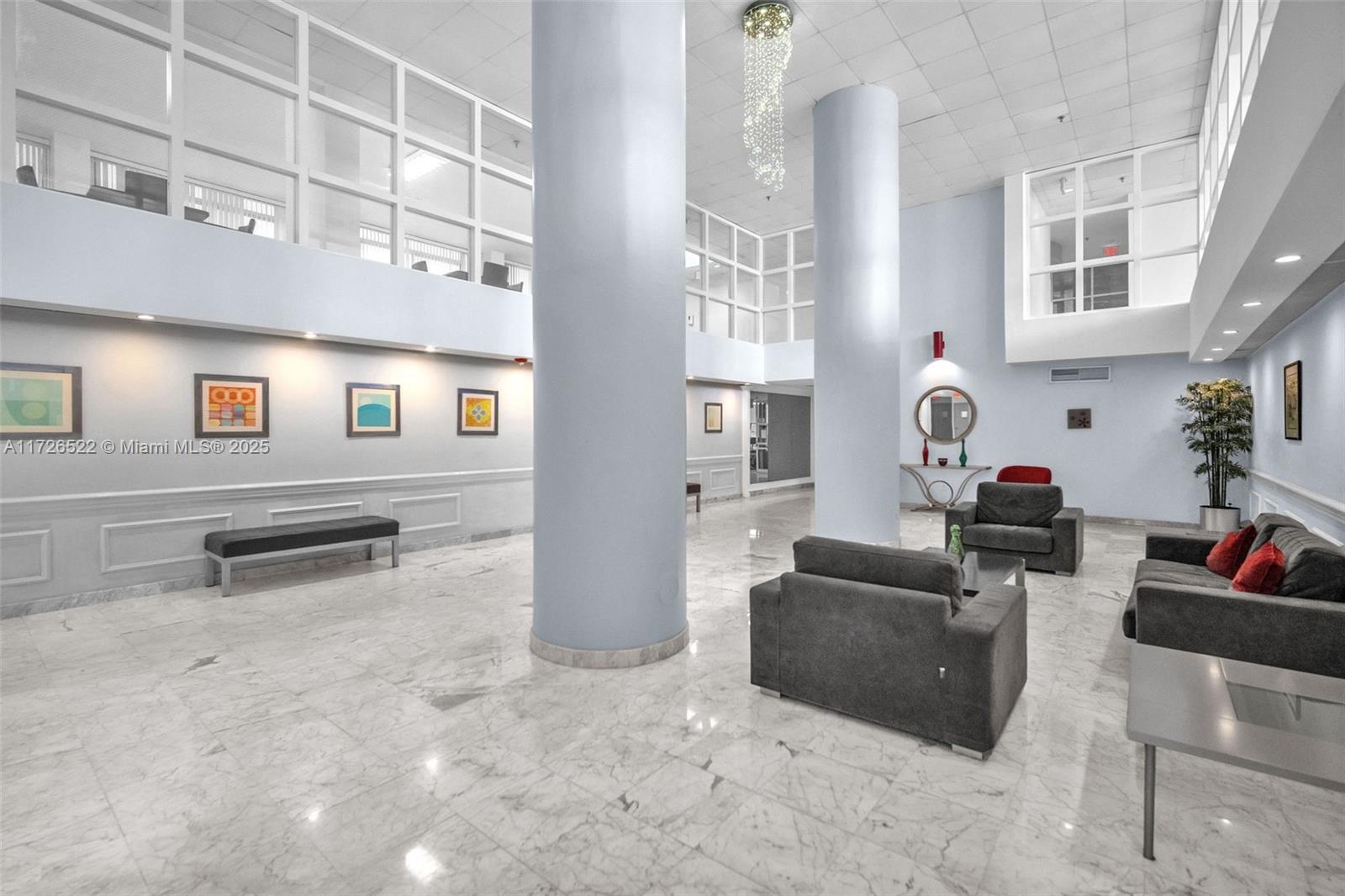 9341 Collins Avenue, Unit 1205 Surfside, FL 33154 - Photo 24 of 29 a living room with furniture and a potted plant