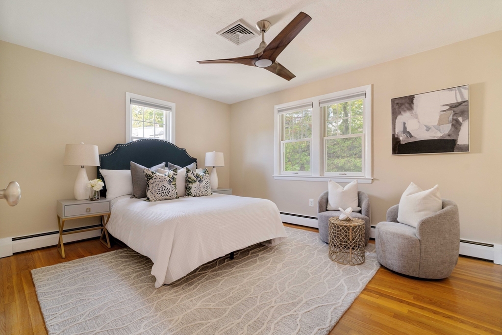 10 Hackensack Terrace Boston, MA 02467 - Photo 15 of 30 a bedroom with a bed and wooden floor