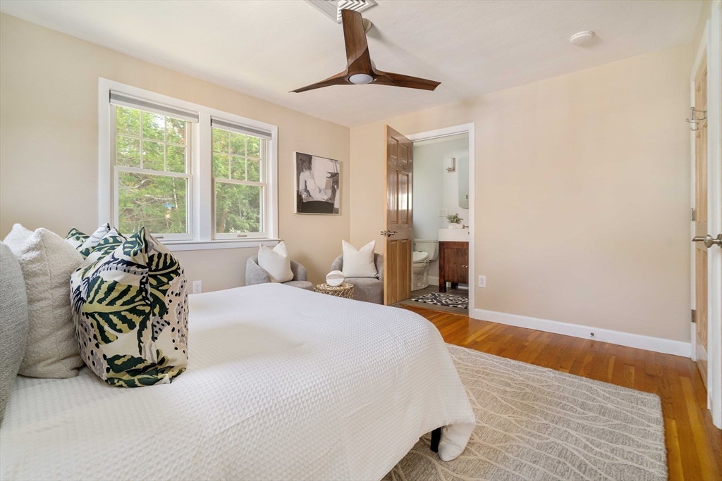 10 Hackensack Terrace Boston, MA 02467 - Photo 16 of 30 a bedroom with a bed and wooden floor