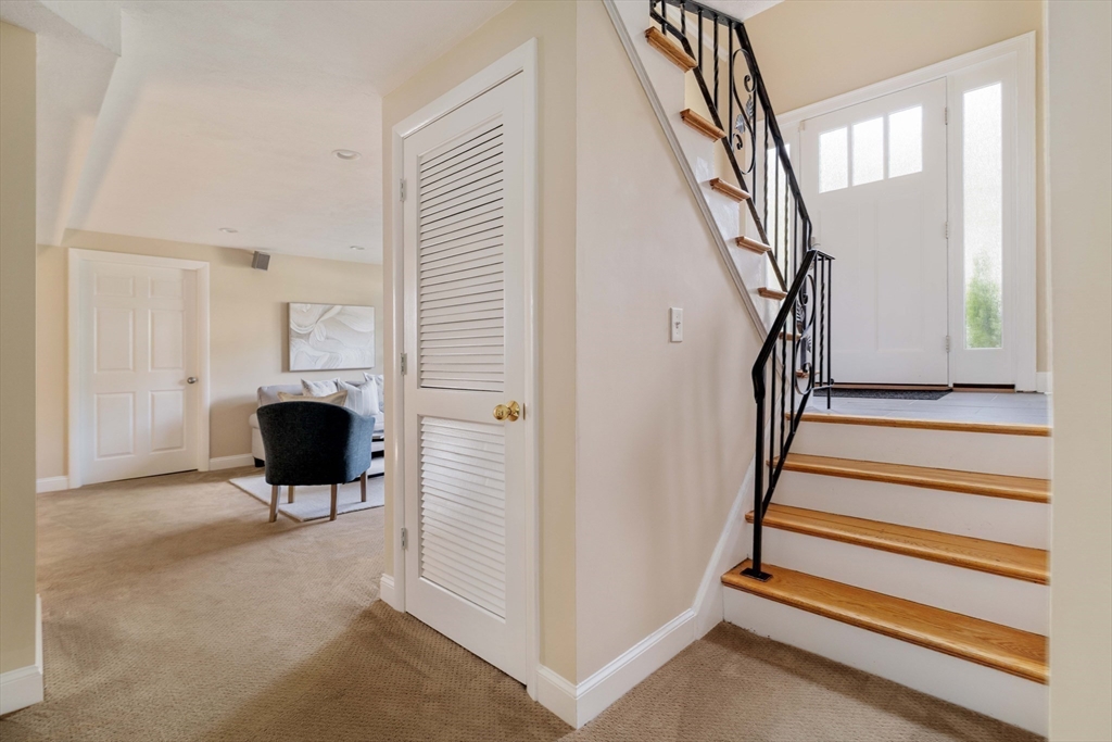 10 Hackensack Terrace Boston, MA 02467 - Photo 20 of 30 a view of a livingroom with wooden floor and stairs