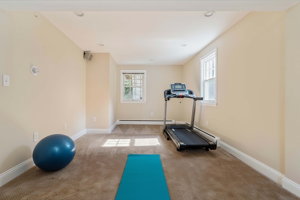 10 Hackensack Terrace Boston, MA 02467 - Photo 25 of 30 a room with gym equipment and a window
