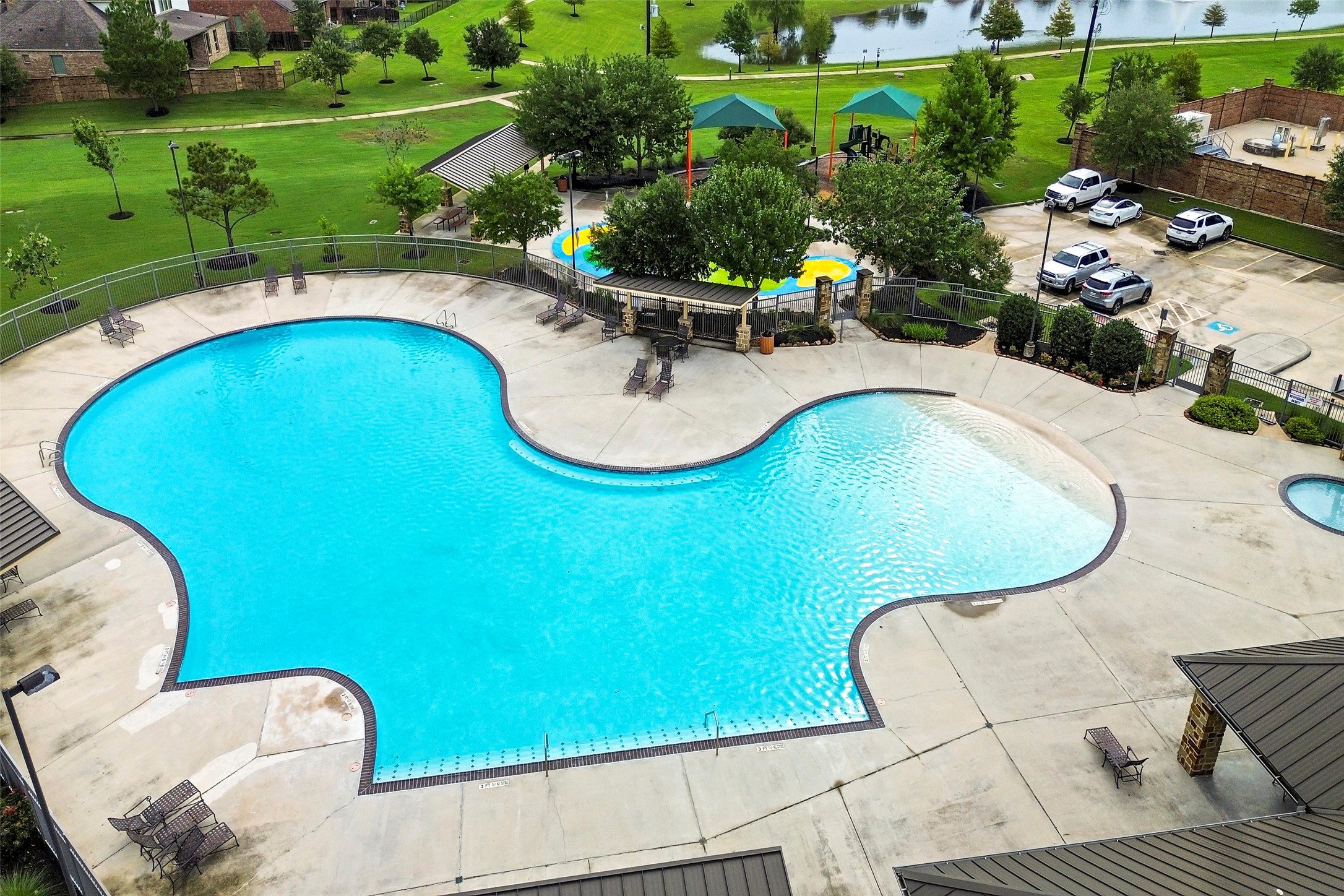 20330 Rosegold Way Spring, TX 77379 - Photo 45 of 48 Aerial view of the community pool, splash pad, playground, and recreation facilities.