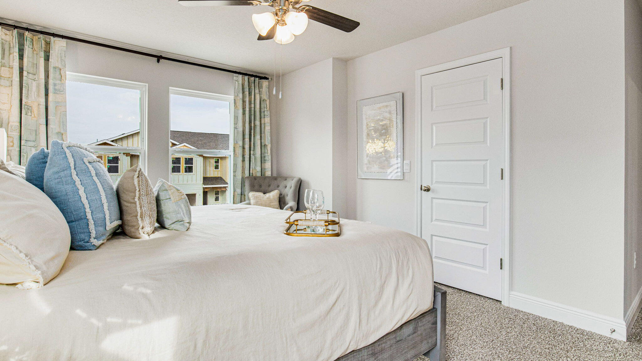 8513 Midtown Court Navarre, FL 32566 - Photo 18 of 27 a bedroom with a bed a window and a chandelier