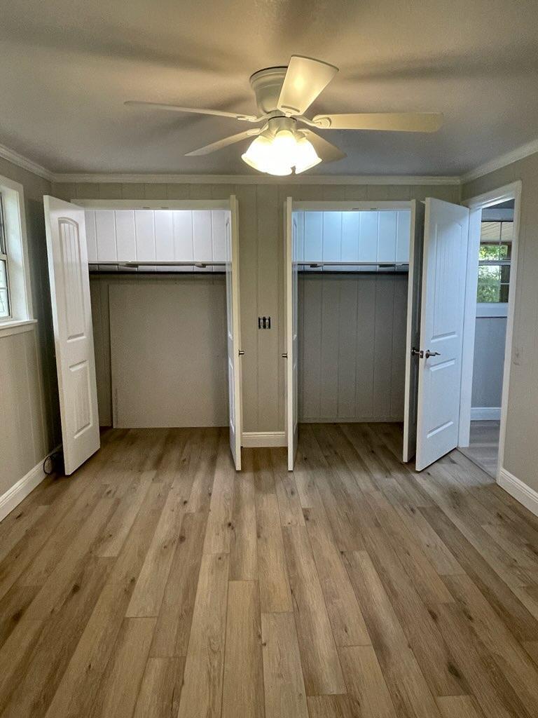 133 3rd Street, Unit B Niceville, FL 32578 - Photo 24 of 32 a view of a room with wooden floor and staircase