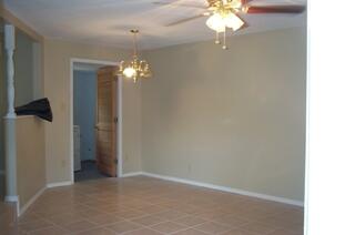 133 3rd Street, Unit B Niceville, FL 32578 - Photo 5 of 32 a view of a chandelier in big room and chandelier