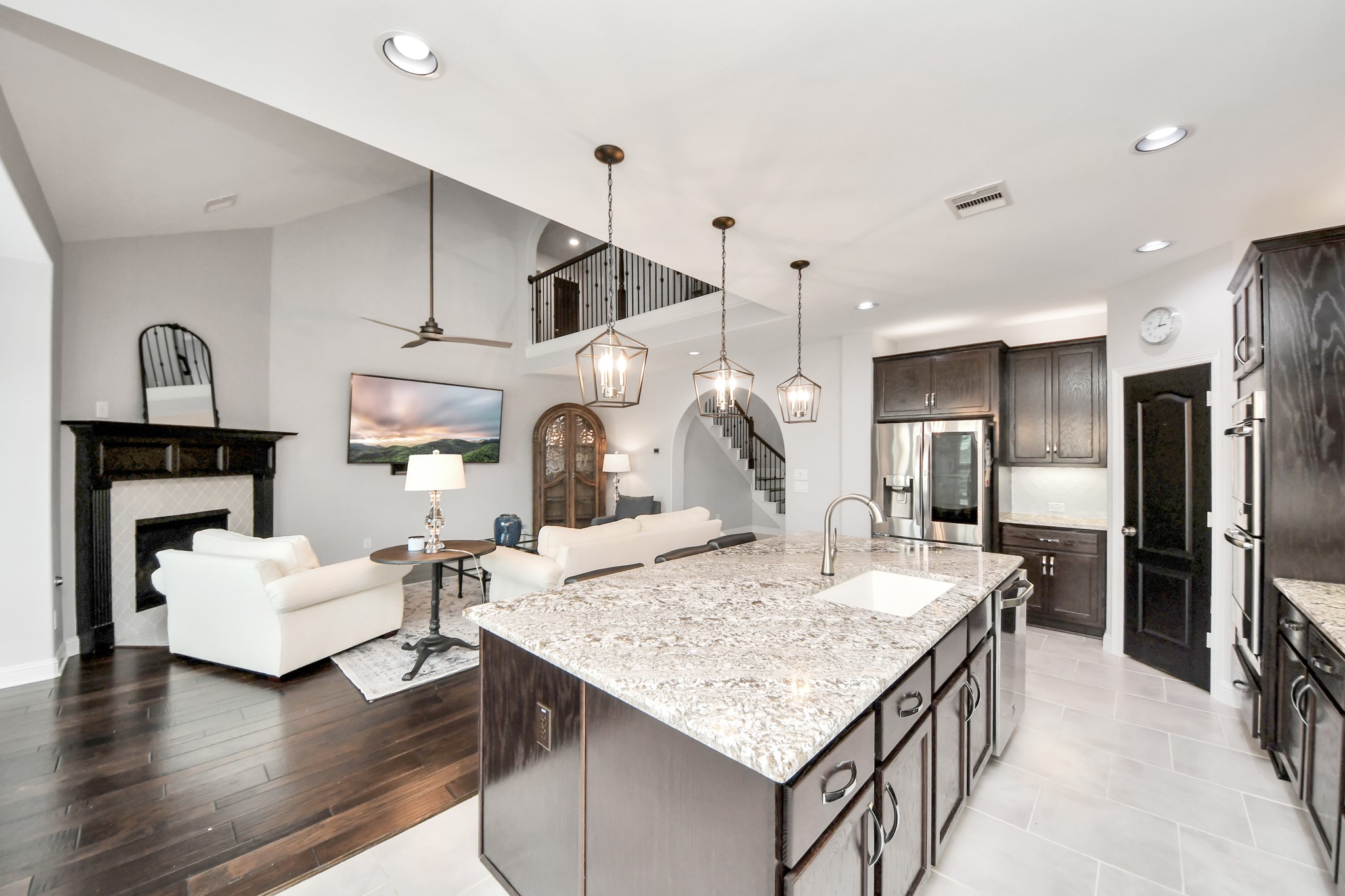 2811 Hadley Springs Lane Spring, TX 77386 - Photo 11 of 50 a kitchen with a table chairs refrigerator and wooden floor