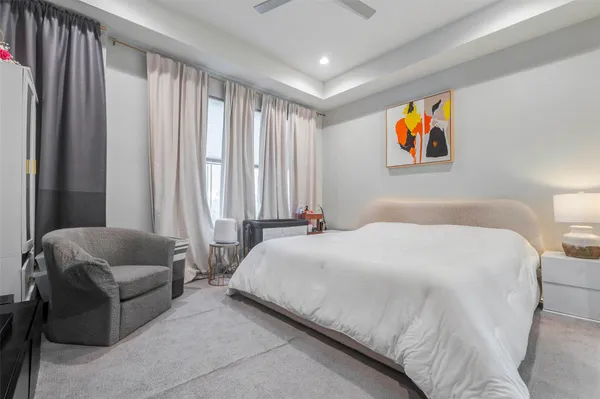 a bedroom with bed and a couch