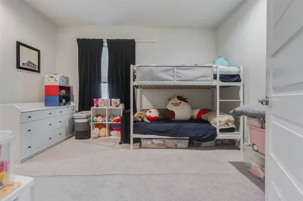a bedroom with a bed and closet