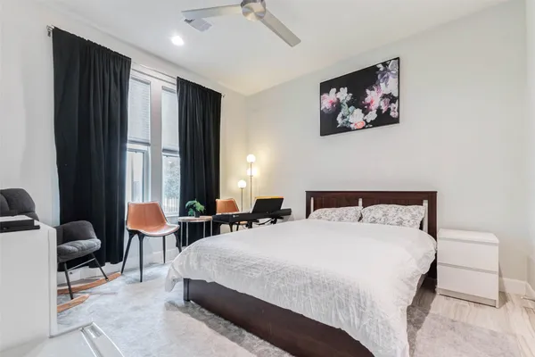 a bedroom with double bed and a window