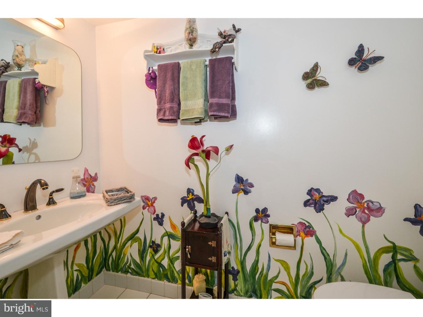 209 Radburn Road Philadelphia, PA 19115 - Photo 12 of 24 a bathroom with a sink mirror and vanity